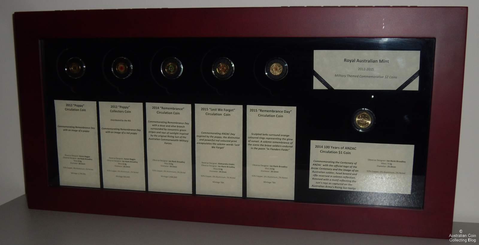 Australian Coin Display Featuring Military Themed Commemorative Dollar and $2 Coins